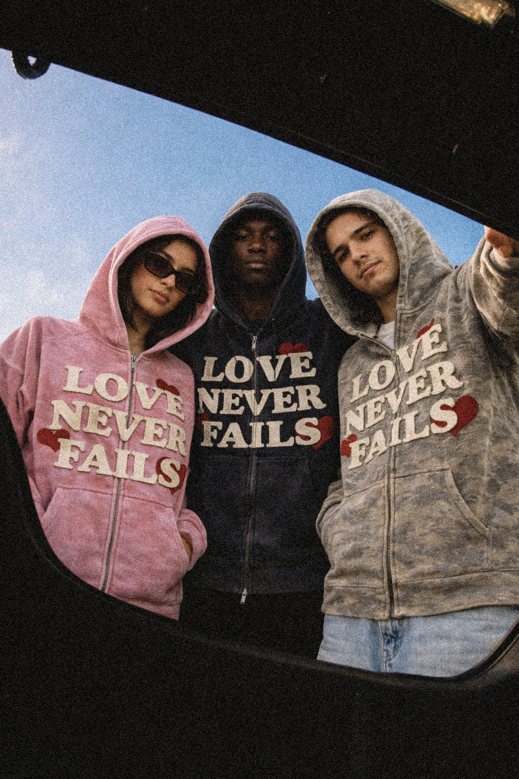 LOVE NEVER FAILS DISTRESSED HEAVYWEIGHT ZIP HOODIE
